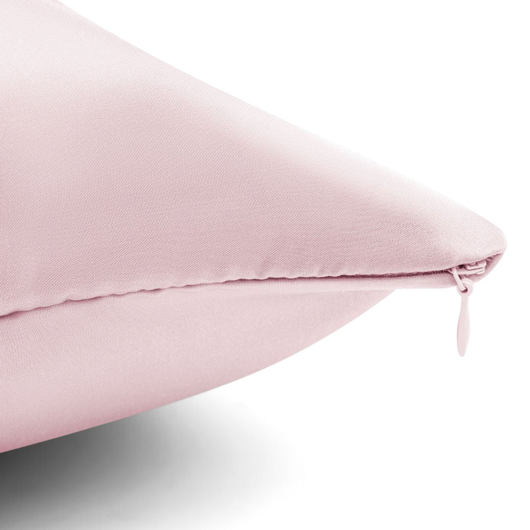 Close-up of blush pink pillowcase with hidden zipper detail