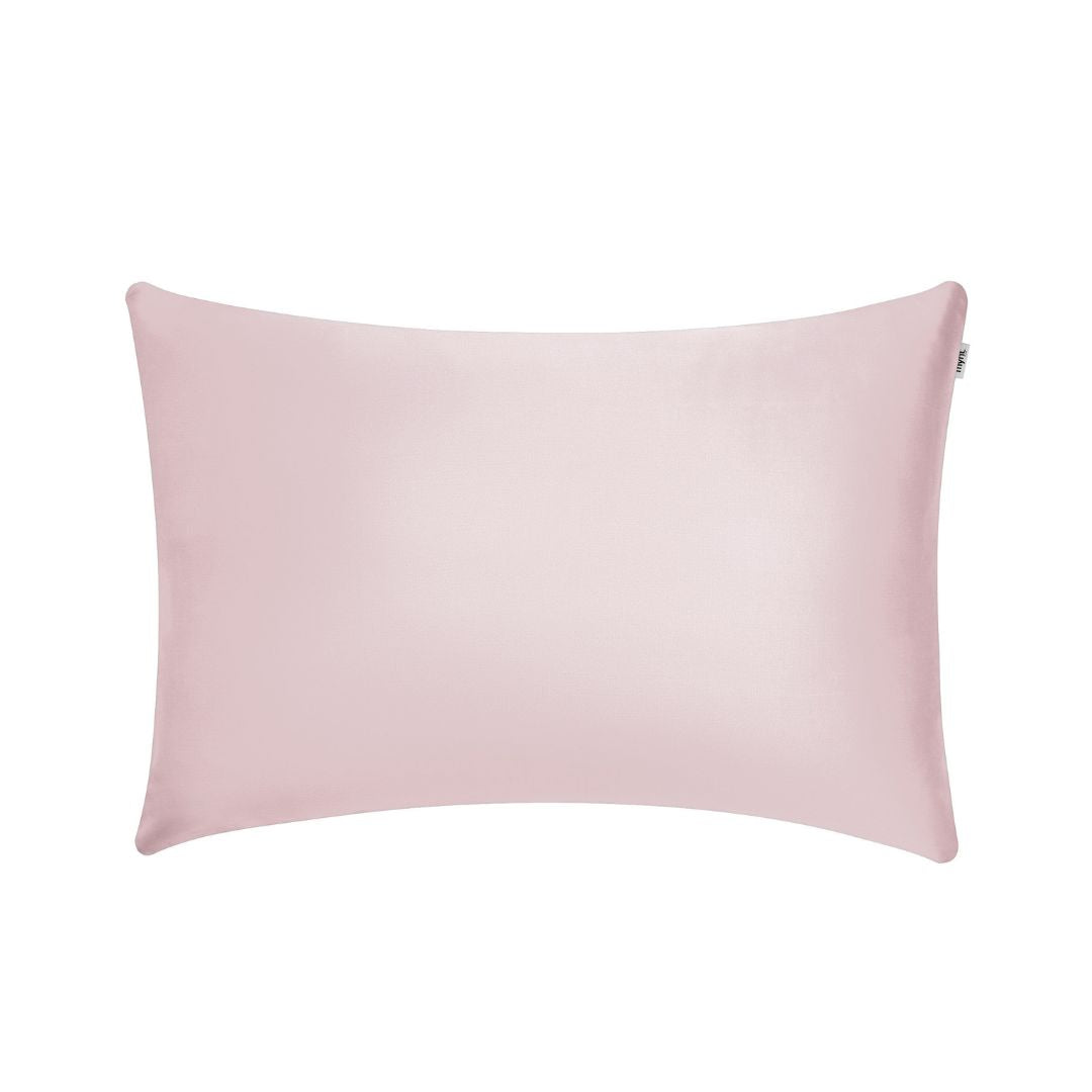 Blush pink plant-based silk pillowcase on white background