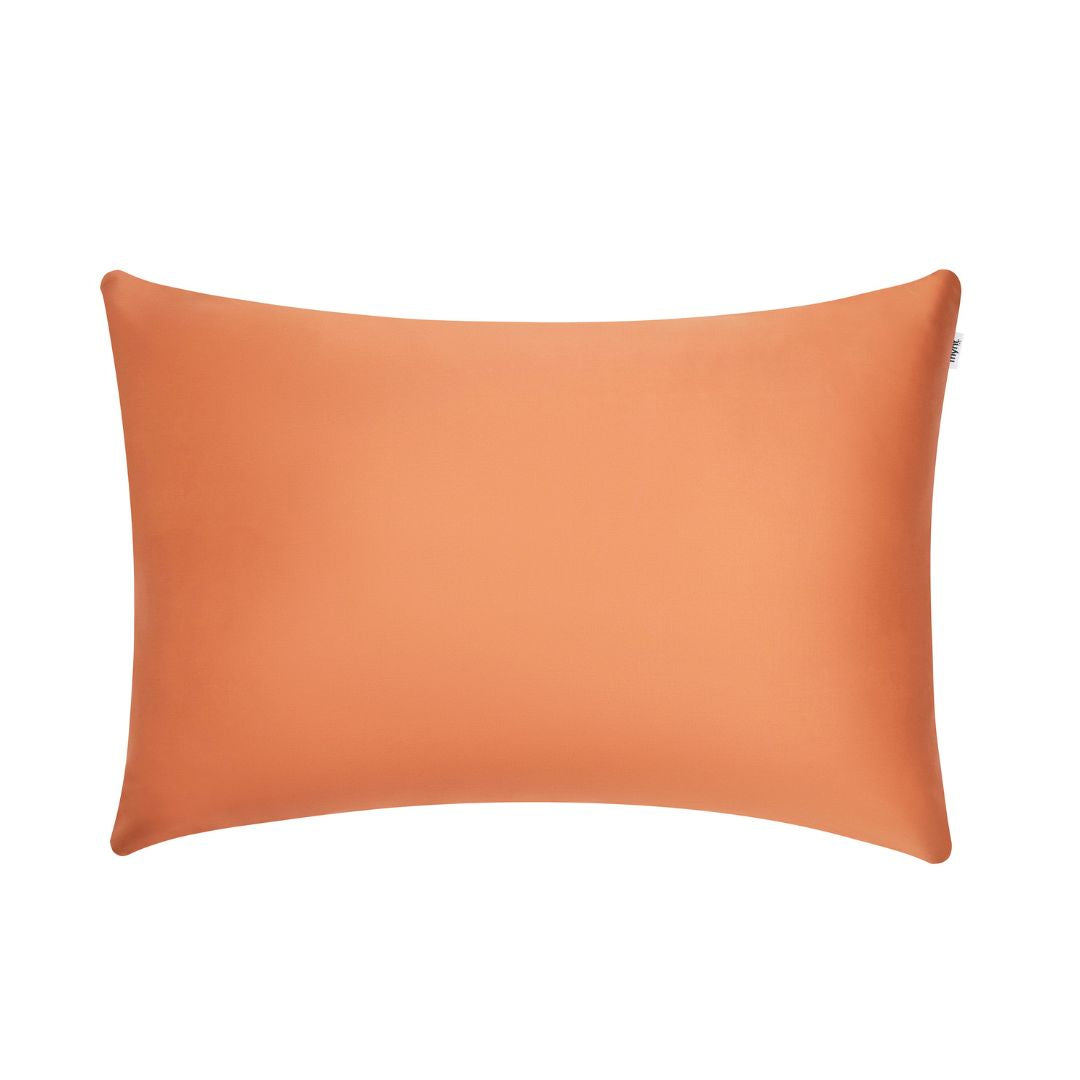 Terracotta vegan silk pillowcase made from sustainable plant-based fabric on white background