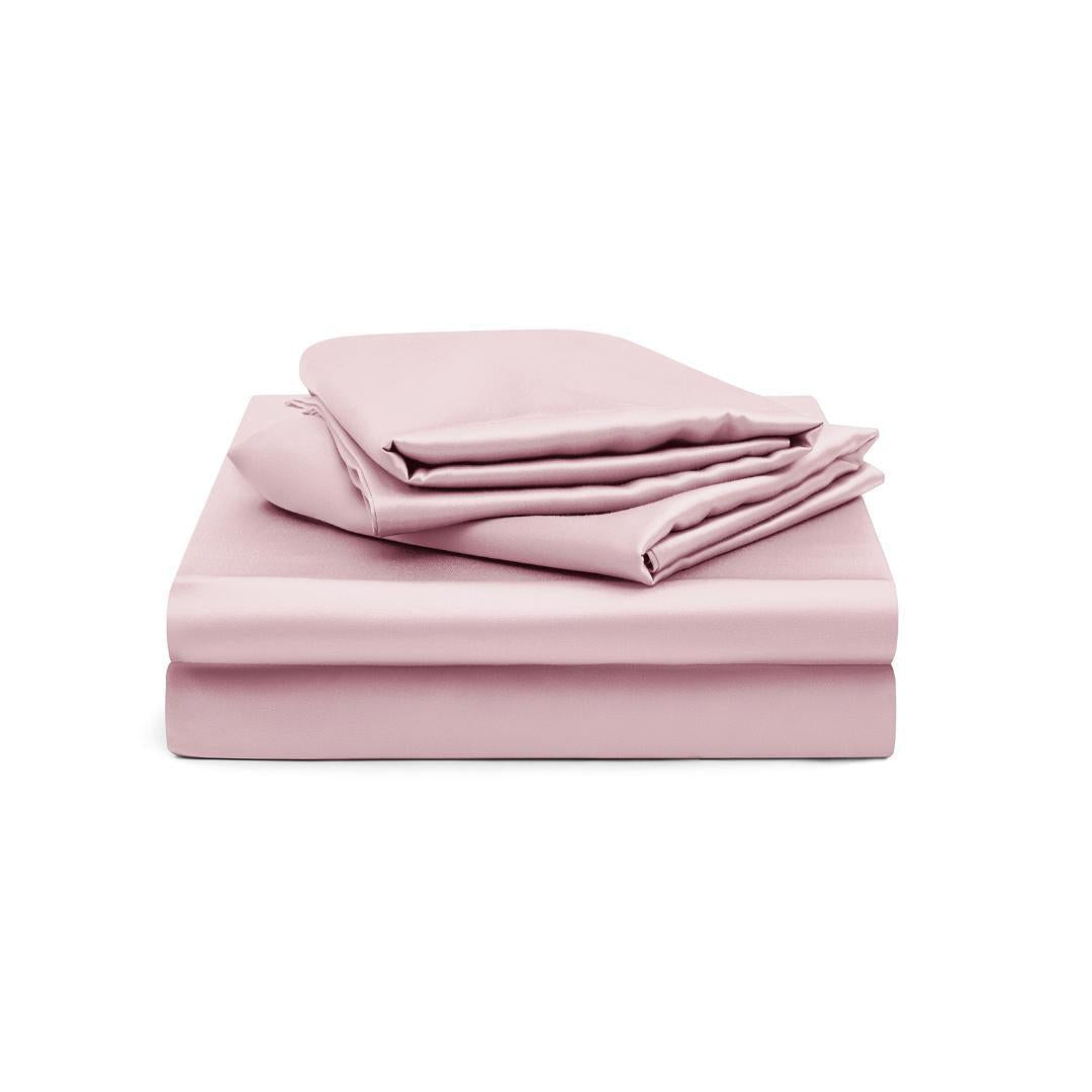 A neatly stacked Fitted Sheet Set (3-Piece) in silky soft, light pink fabric - including a fitted sheet, flat sheet, and pillowcases - displayed on a white background.