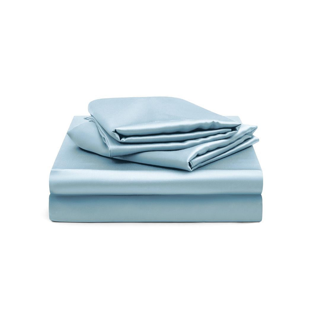 The Fitted Sheet Set, in silky soft light blue, includes a fitted sheet and pillowcases stacked neatly on a white background.