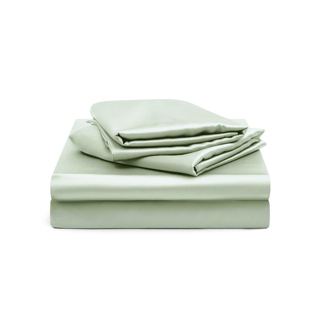 The Fitted Sheet Set features silky soft sage green sheets, including a fitted sheet and two pillowcases, displayed neatly against a white background.