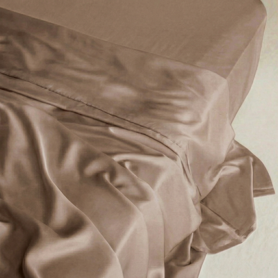 MyntBalance™ flat sheet in a warm taupe TENCEL™ lyocell, draped with soft folds and a generous tuck.