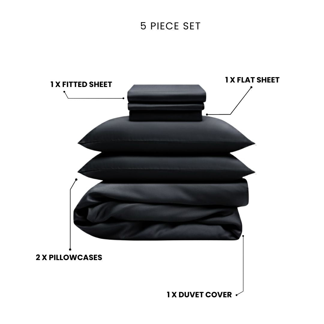 The Mynt Lab MyntFusion™ Complete Bedding Bundle (5-Piece) in black features cooling, antibacterial sheets and includes a fitted sheet, flat sheet, duvet cover, and two pillowcases - all shown neatly stacked and separated.