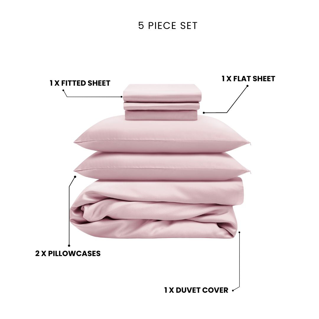 The Mynt Lab MyntFusion™ Complete Bedding Bundle (5-Piece) in pale pink showcases antibacterial fabric with a fitted sheet, flat sheet, two pillowcases, and a duvet cover - each item stacked neatly and labeled with arrows.