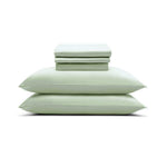 The Mynt Lab MyntFusion™ Complete Sheet Set (4-Piece) features light green, silky soft sheets and pillowcases, neatly stacked with two pillows at the bottom and folded linens on top, displayed against a plain white background.