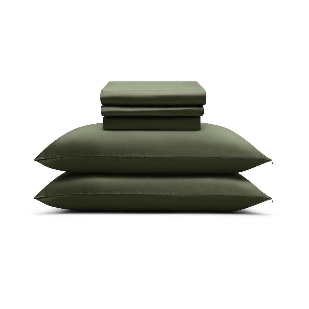 The Mynt Lab MyntFusion™ Complete Sheet Set (4-Piece), featuring silky soft sheets and pillowcases, is neatly folded and stacked atop two matching pillows against a plain white background.