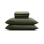 The Mynt Lab MyntFusion™ Complete Sheet Set (4-Piece), featuring silky soft sheets and pillowcases, is neatly folded and stacked atop two matching pillows against a plain white background.