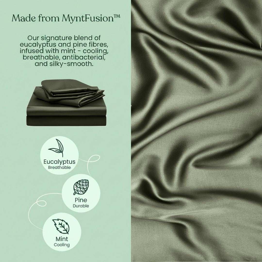 A stack of Mynt Lab’s MyntFusion™ Fitted Sheet Set in green beside silky fabric, offering cooling, breathable, and hypoallergenic comfort— - deal for hot sleepers with eucalyptus, pine, and mint fibres.