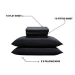 Black bedding set with flat sheet, fitted sheet, and two pillowcases on a white background.