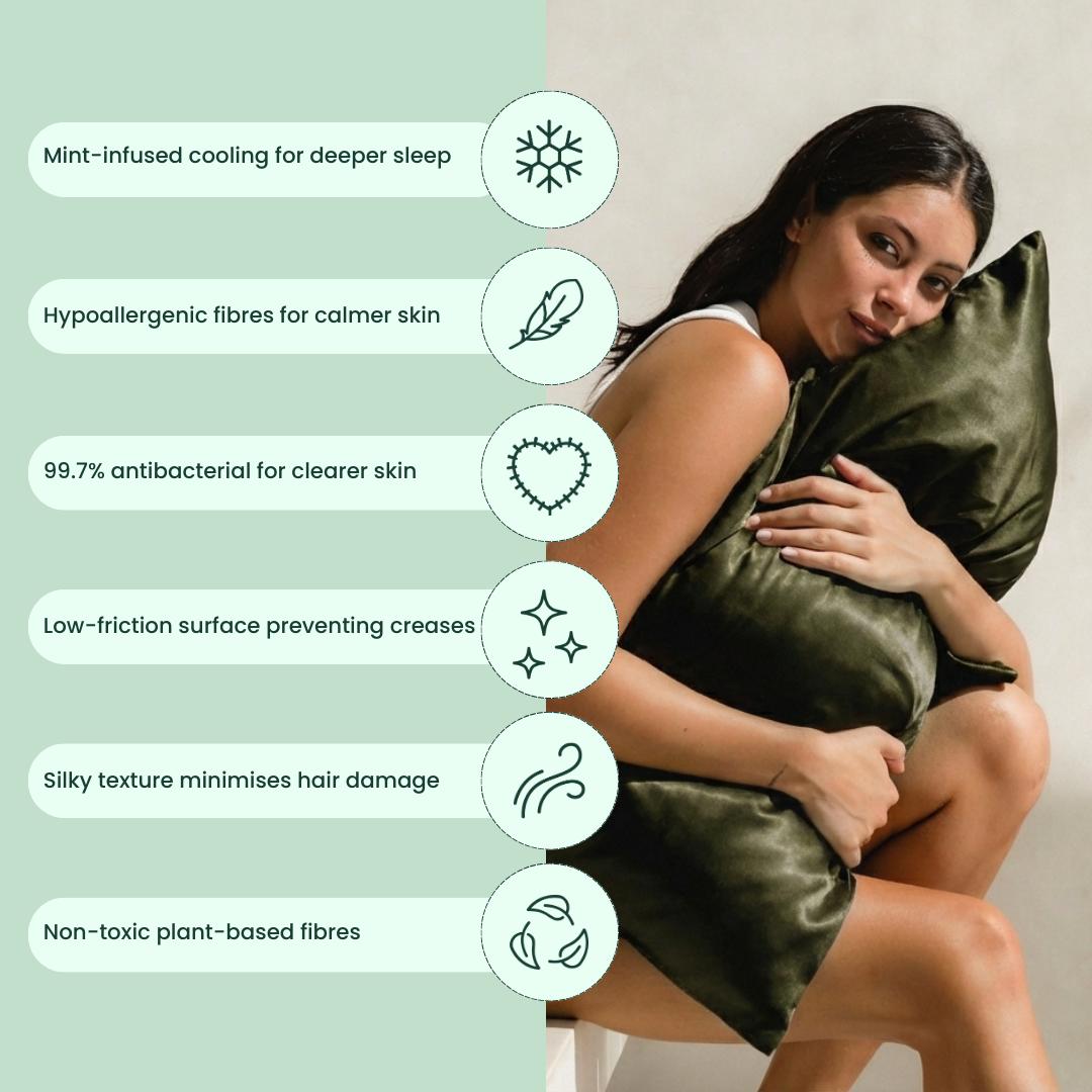 A woman hugs an olive green, silky pillow from the Deep Sleep Bundle. Six icons show its benefits: cooling, hypoallergenic, antibacterial, low-friction, silky texture, and non-toxic plant-based fibres for deeper sleep.