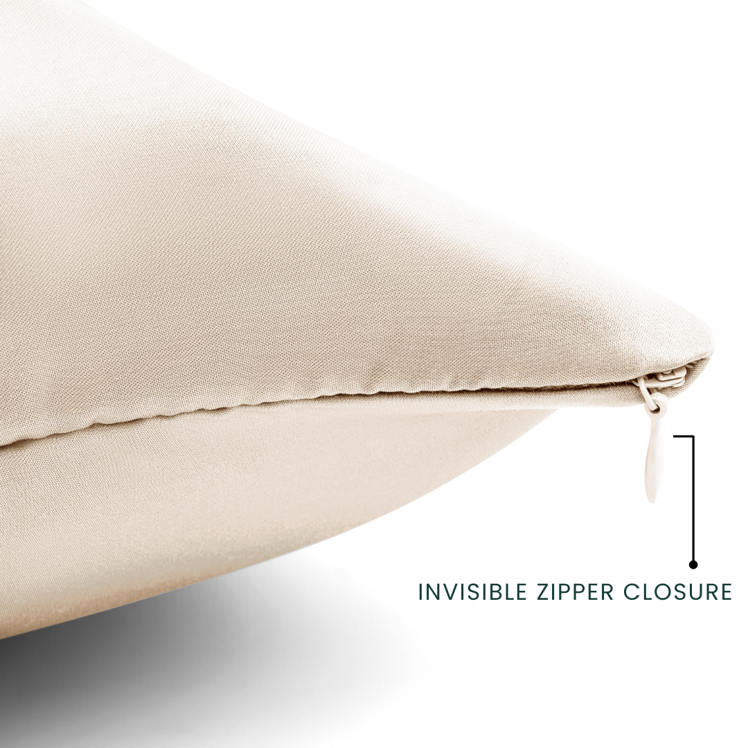 Beige pillow with an invisible zipper closure on a white background