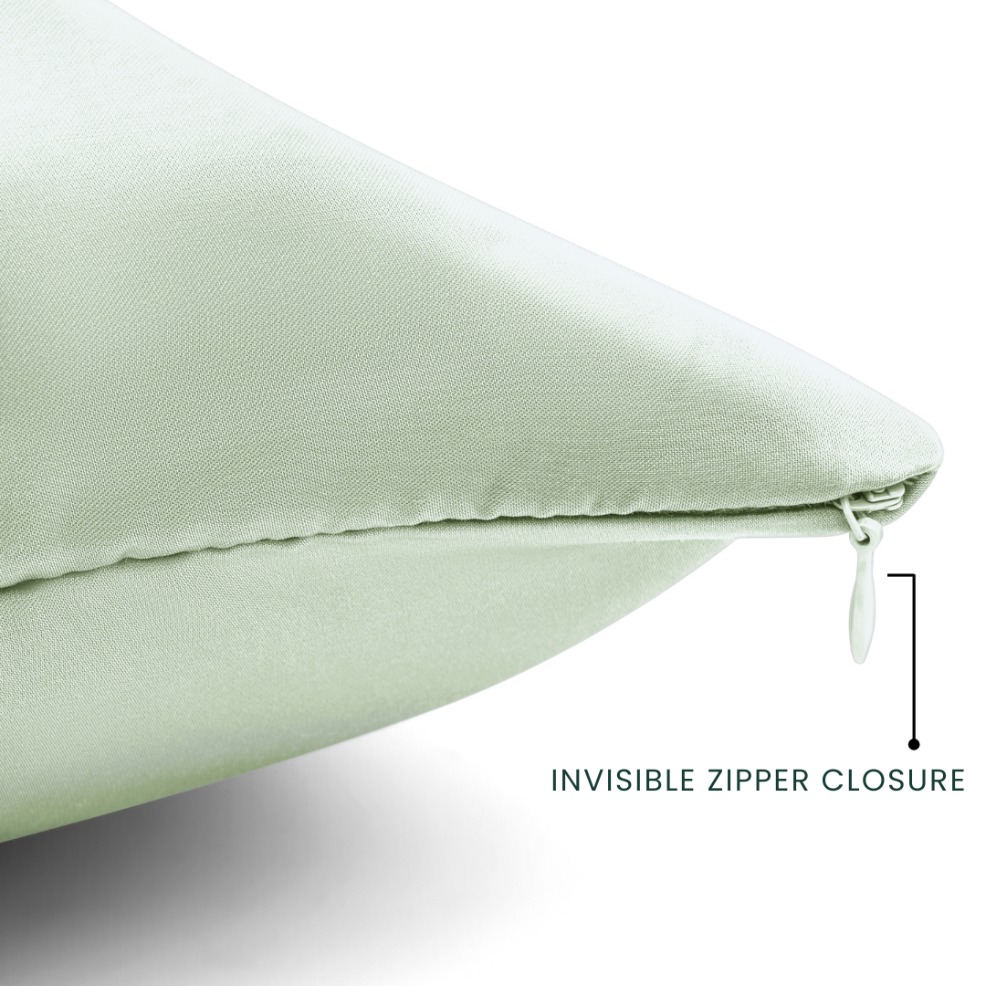 Light green pillow with an invisible zipper closure on a white background