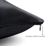 Black pillow with an invisible zipper closure on a white background
