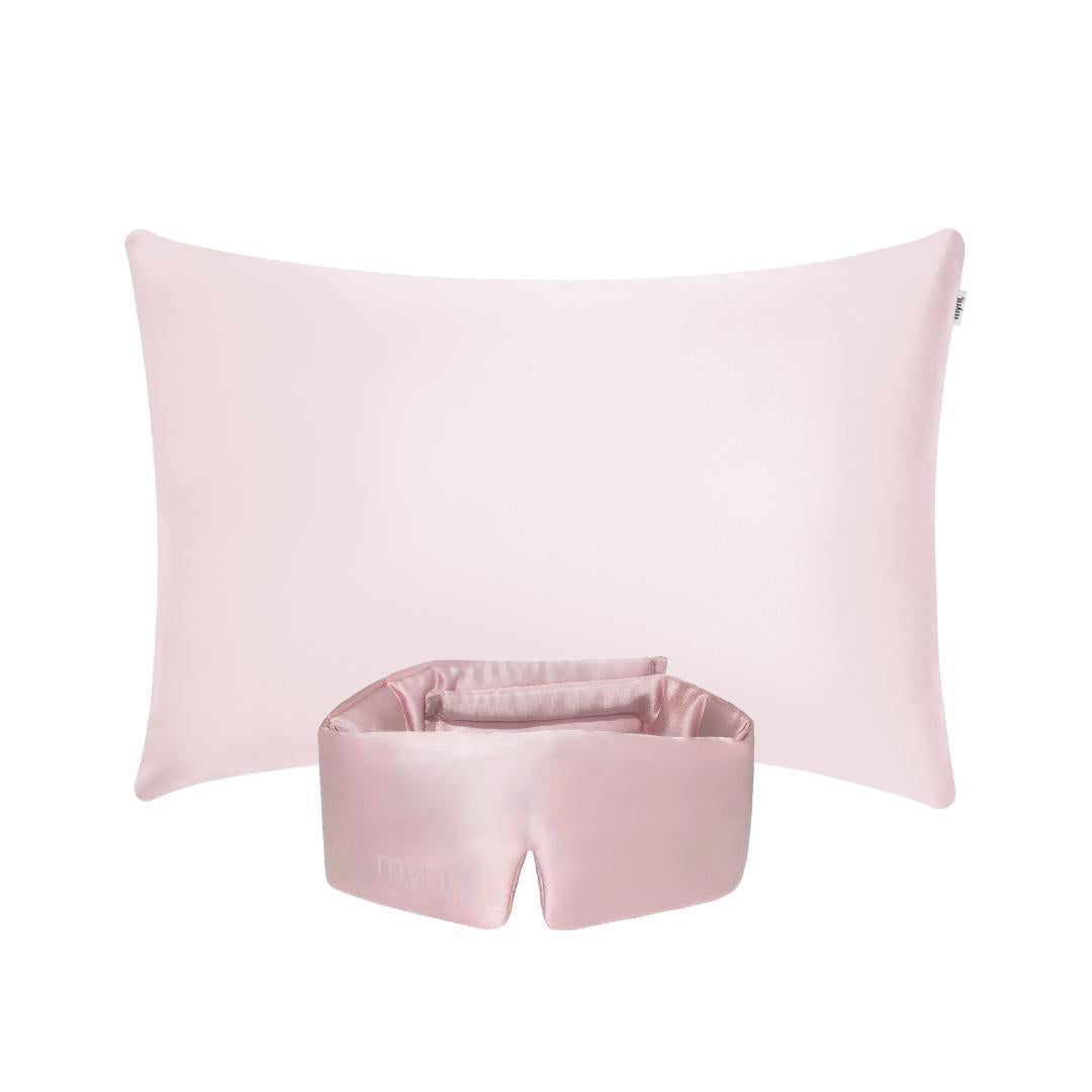 The Deep Sleep Bundle, featuring a light pink cooling pillowcase and matching pink silky blackout sleep mask, is displayed against a white background - ideal for deep sleep.