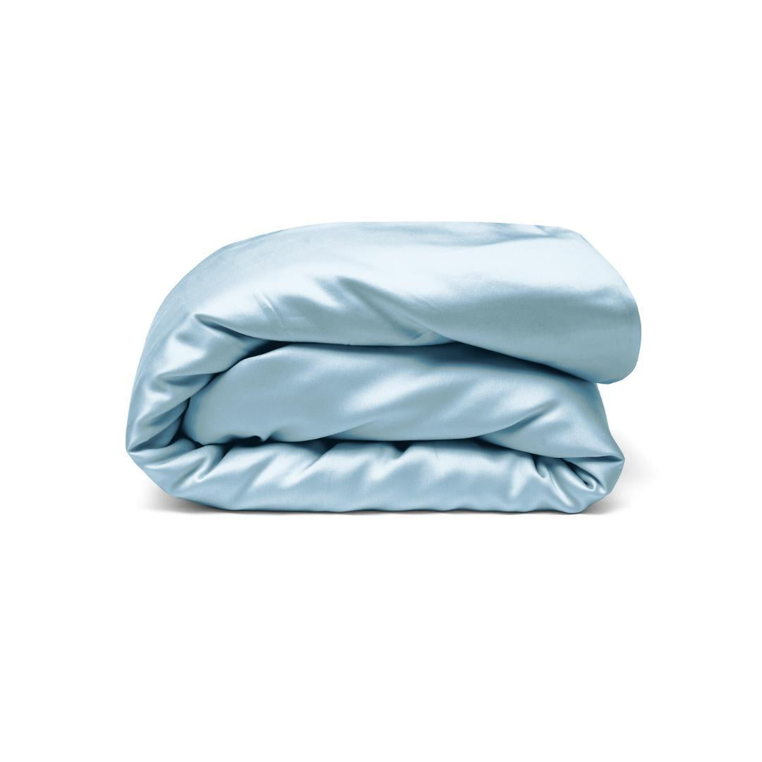 A neatly folded, light blue Duvet Cover is displayed against a plain white background.
