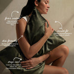 A woman hugs the MyntFusion™ Pillowcase by Mynt Lab, featuring frizz reduction, 99.7% antibacterial & hypoallergenic skin-friendly fabric, secure zipper closure, and cool silky-smooth comfort for restful sleep.