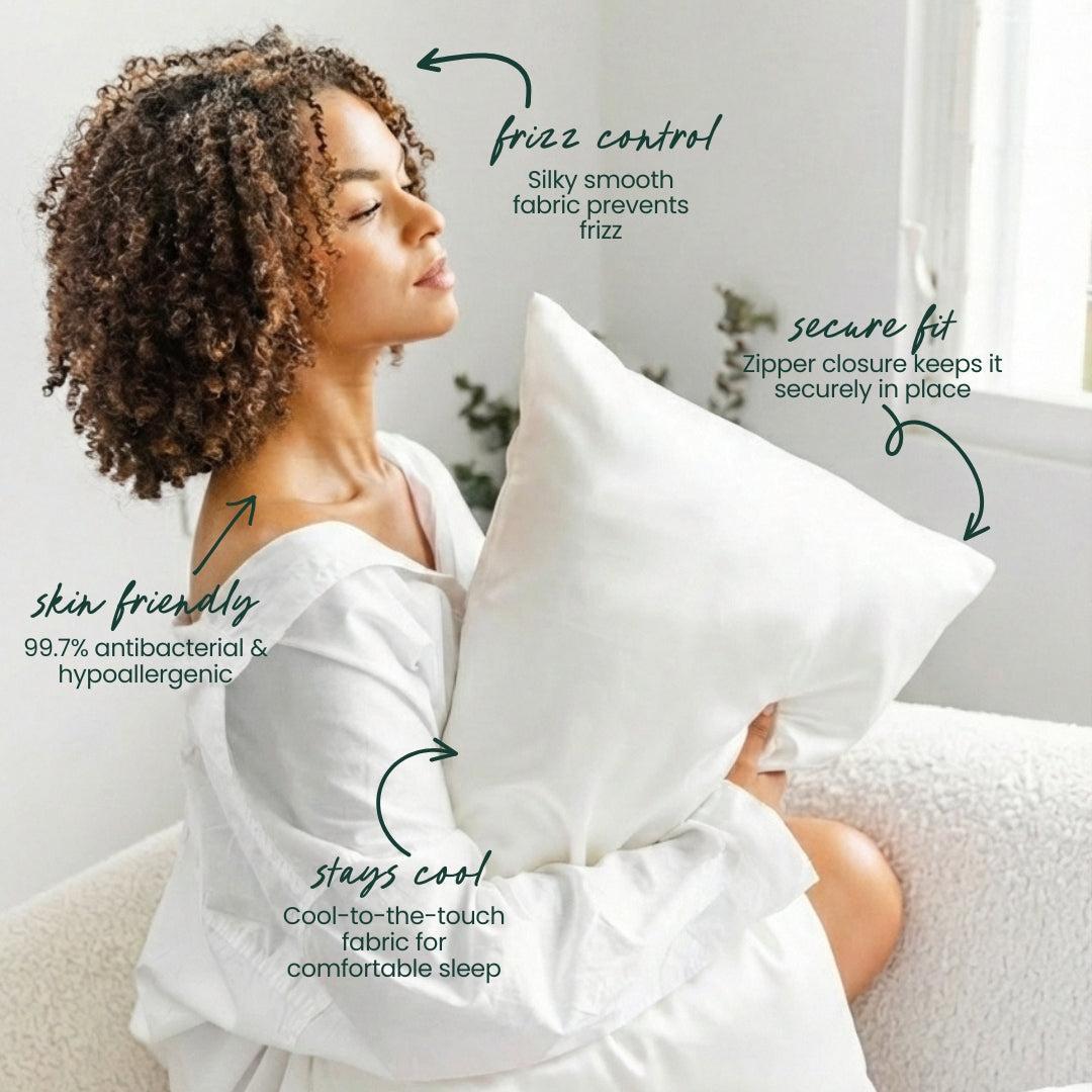 A woman with curly hair sits on a white sofa, hugging a Mynt Lab MyntFusion™ Pillowcase. Text highlights its benefits: reduces frizz, secure zippered fit, skin-friendly antibacterial fibers, and cool-to-the-touch comfort.