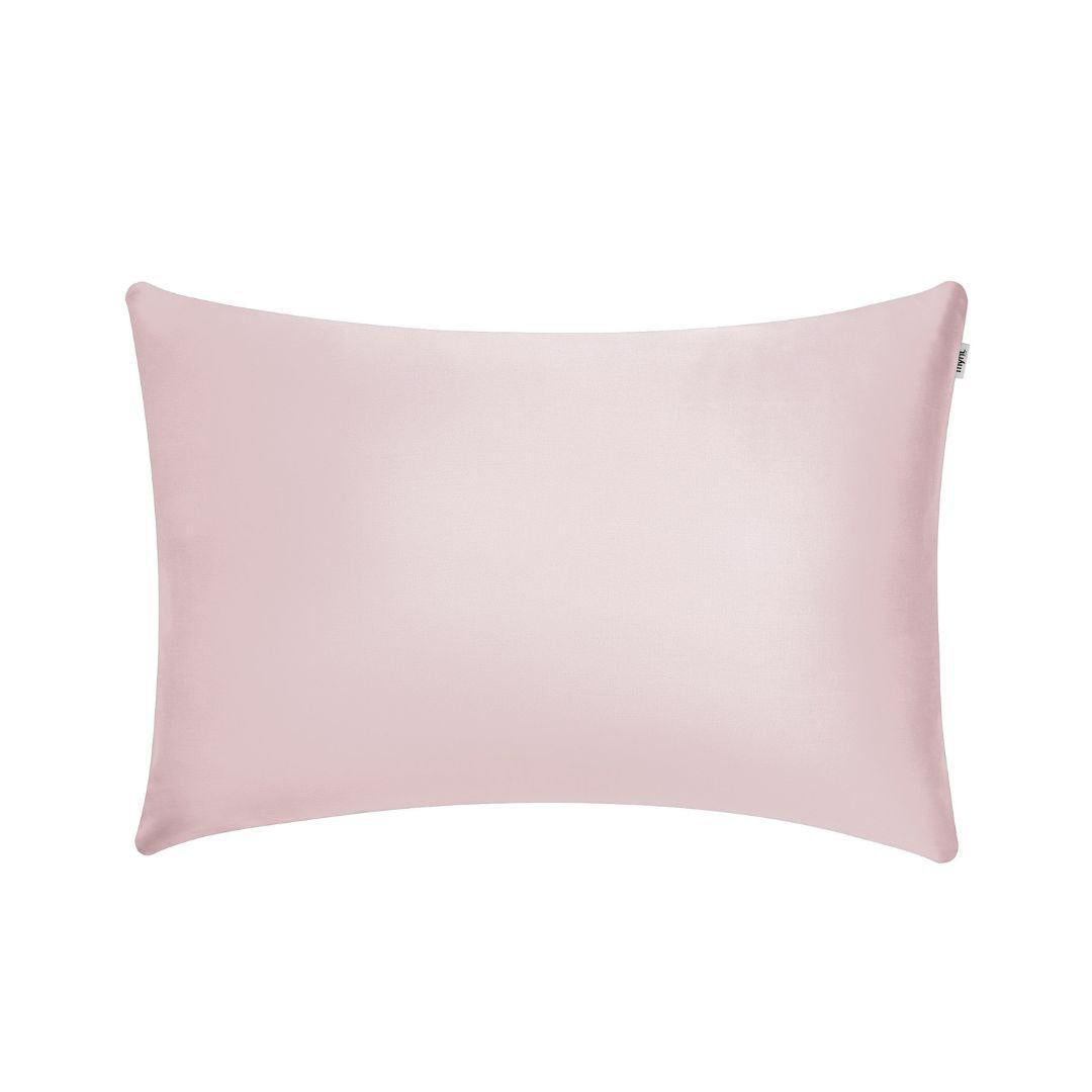 The Mynt Lab Pillowcase is a rectangular, light pink pillow cover with smooth fabric that helps reduce frizz and promote hydrated skin, shown against a plain white background.