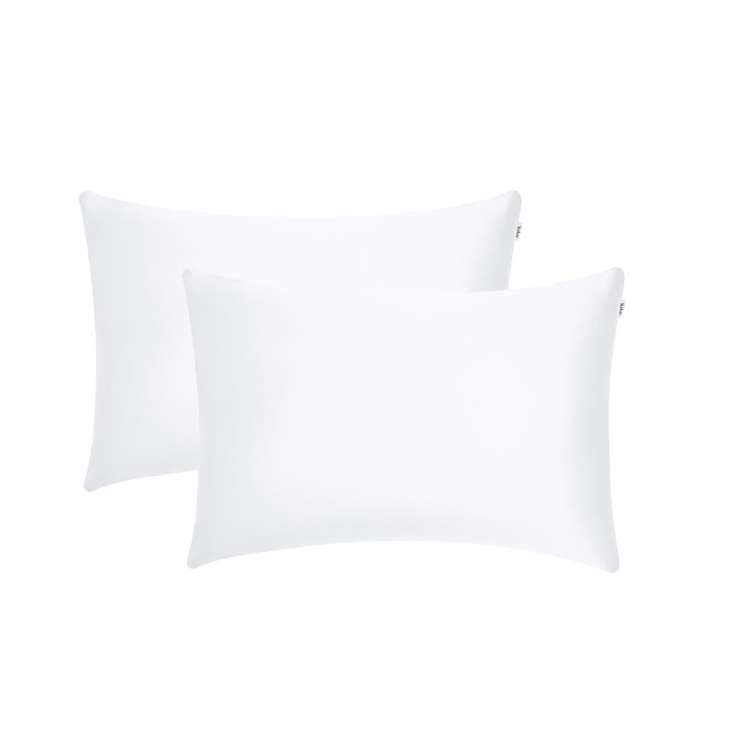 Two plain white pillowcase rectangular pillows, ideal for beauty sleep, are placed side by side on a white background with a slight overlap.