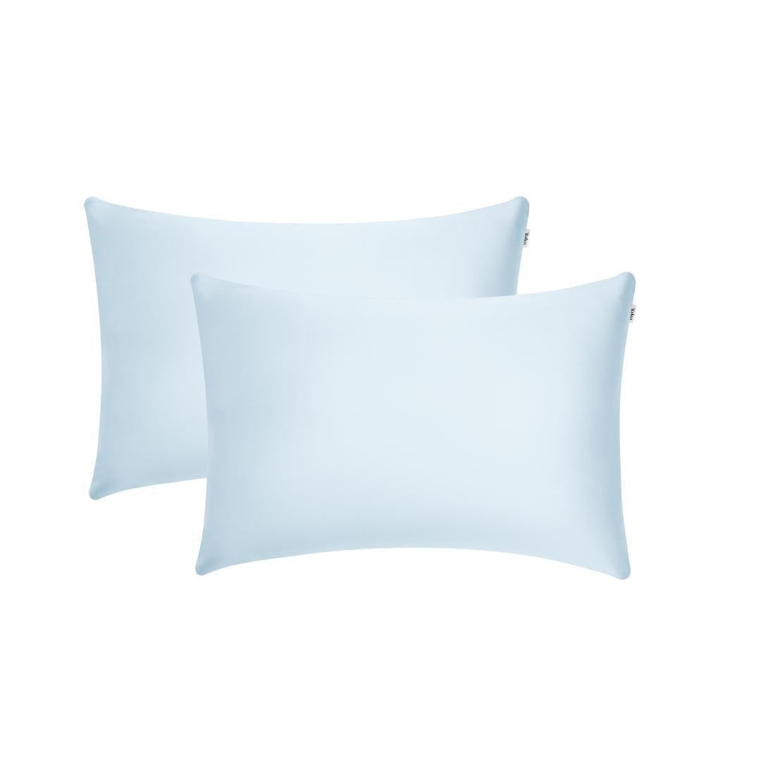 Two light blue rectangular Pillowcases with a smooth, plain surface are shown against a white background, slightly overlapping - ideal for beauty sleep and helping to reduce frizz overnight.