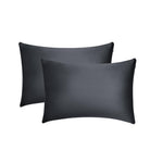 Two black pillowcases are stacked slightly offset against a plain white background, offering a sleek look that enhances beauty sleep and helps reduce frizz.