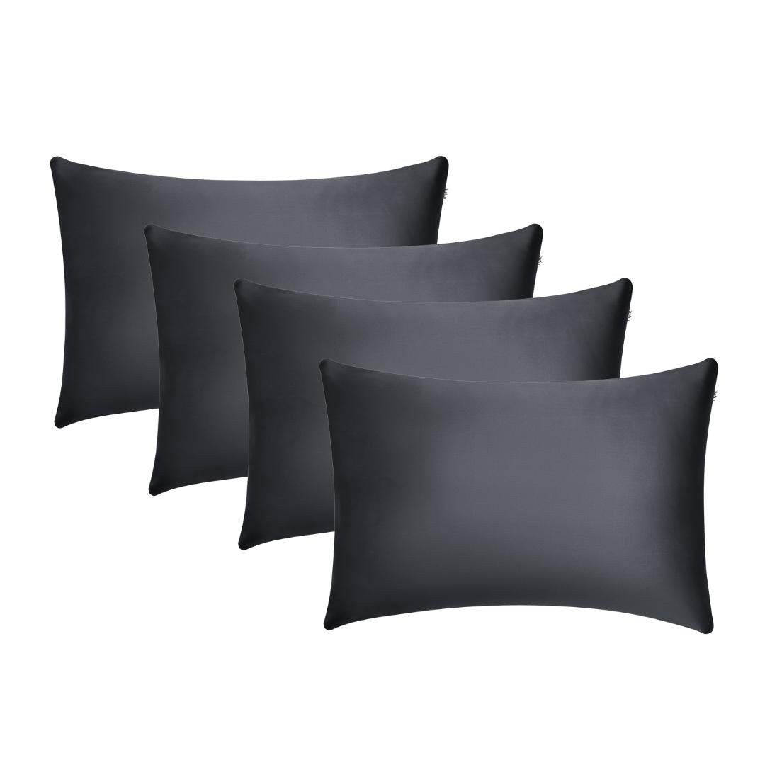 Four black rectangular Pillowcases, ideal for beauty sleep, are arranged in a staggered row on a white background.