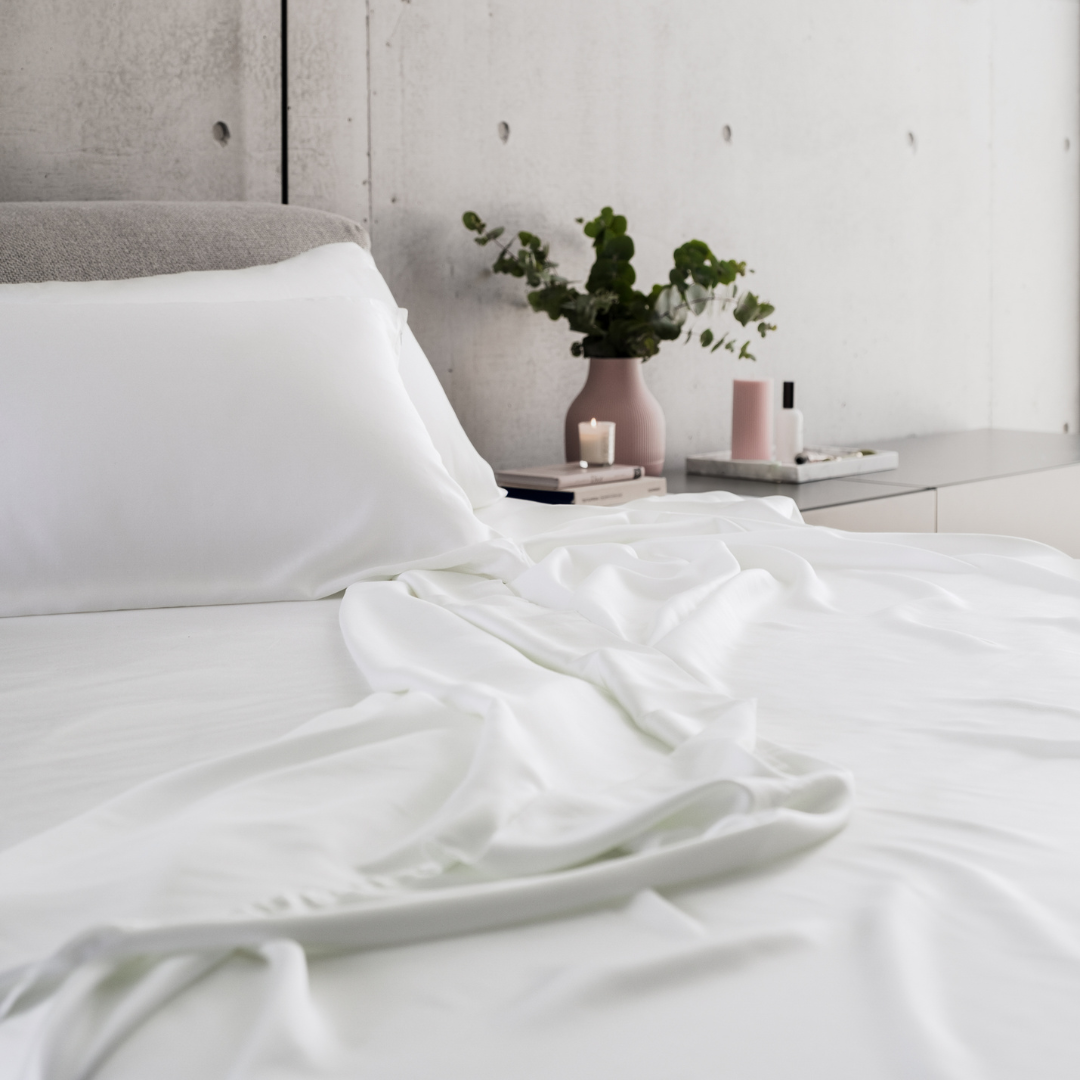 MyntBalance™ temperature balancing flat sheet made from soft, breathable TENCEL™ lyocell fabric draped over bed
