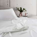 MyntBalance™ temperature balancing flat sheet made from soft, breathable TENCEL™ lyocell fabric draped over bed