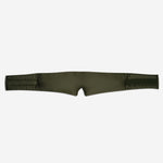 The Sleep Mask, in padded olive-green, features two wide straps and a centre notch for maximum light blocking and deep sleep support, shown laid flat on a white background.