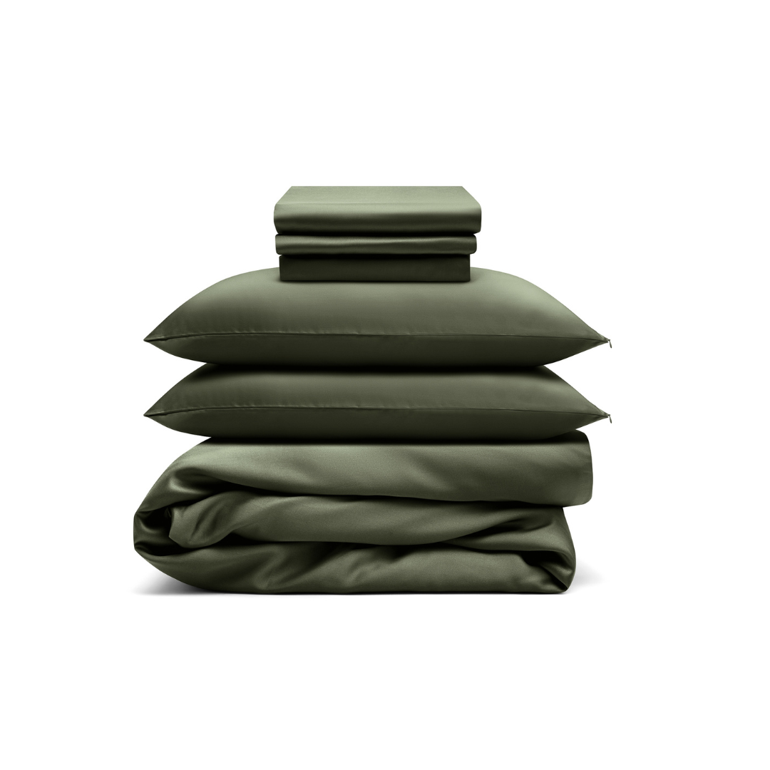 A neatly stacked Bedding Bundle in dark green, featuring two pillowcases, a fitted sheet, a flat sheet, and a folded comforter, is displayed against a white background.