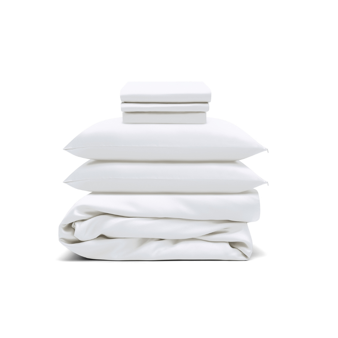 The Bedding Bundle features white antibacterial bedding: two folded sheets, two pillows with pillowcases, and a folded duvet, all neatly stacked against a white background.