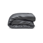 A neatly folded, dark gray comforter or blanket is shown against a plain white background.