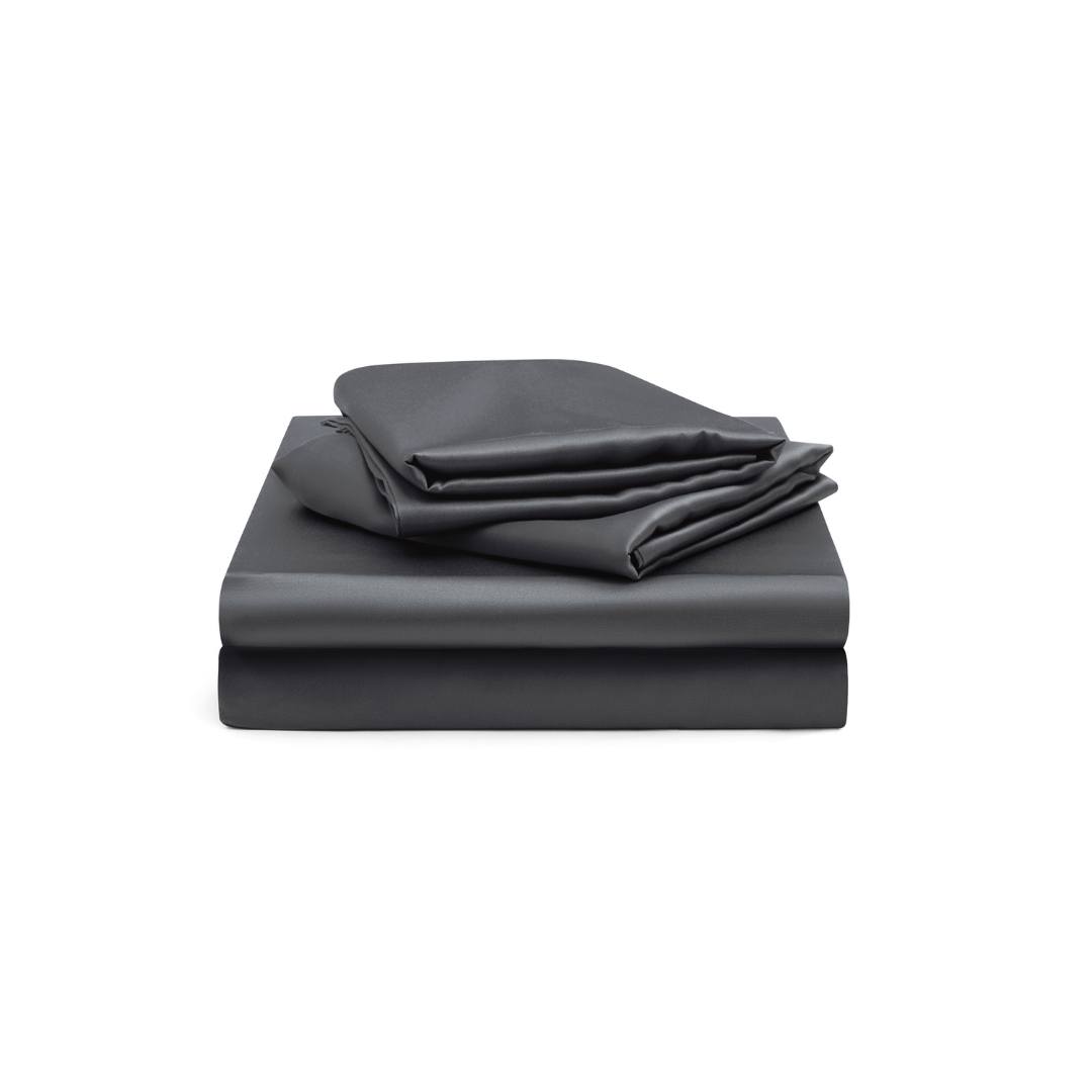 A neatly folded set of dark gray bed sheets, including a fitted sheet, flat sheet, and pillowcase, stacked on a white background.