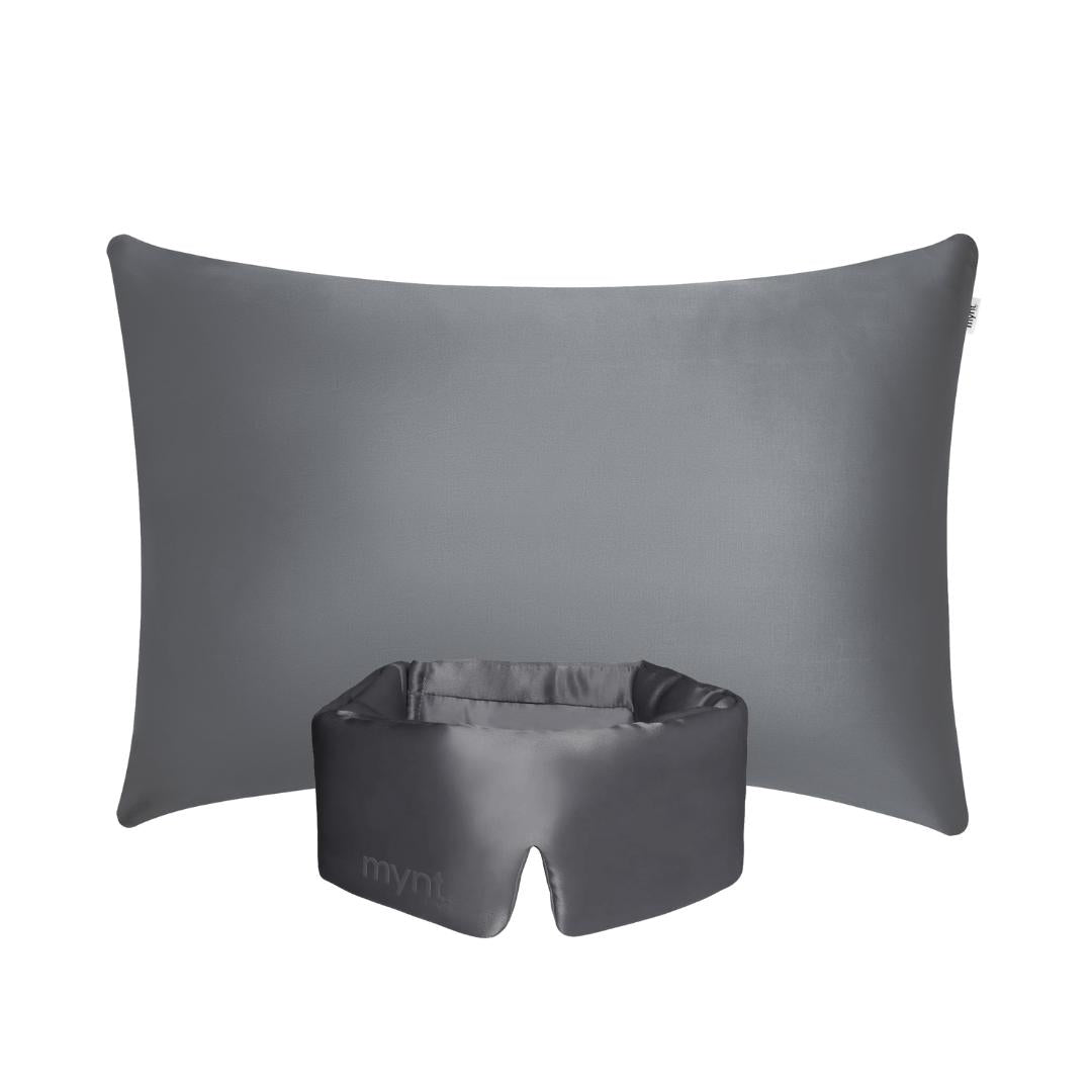 The Deep Sleep Bundle includes a charcoal rectangular pillow with a cooling pillowcase and a matching padded sleep mask with a cutout, both shown on a white background.