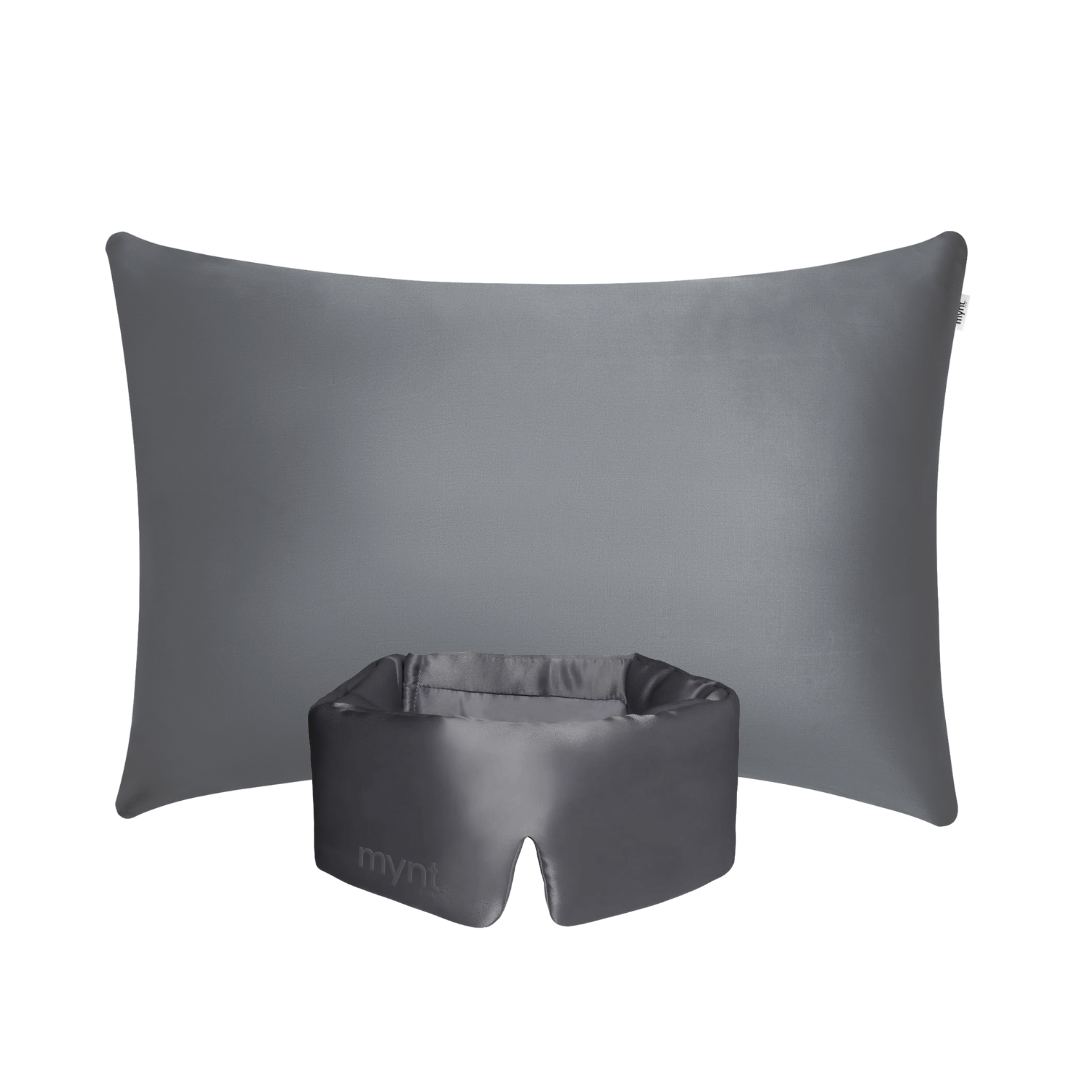 The Deep Sleep Bundle includes a charcoal rectangular pillow with a cooling pillowcase and a matching padded sleep mask with a cutout, both shown on a white background.