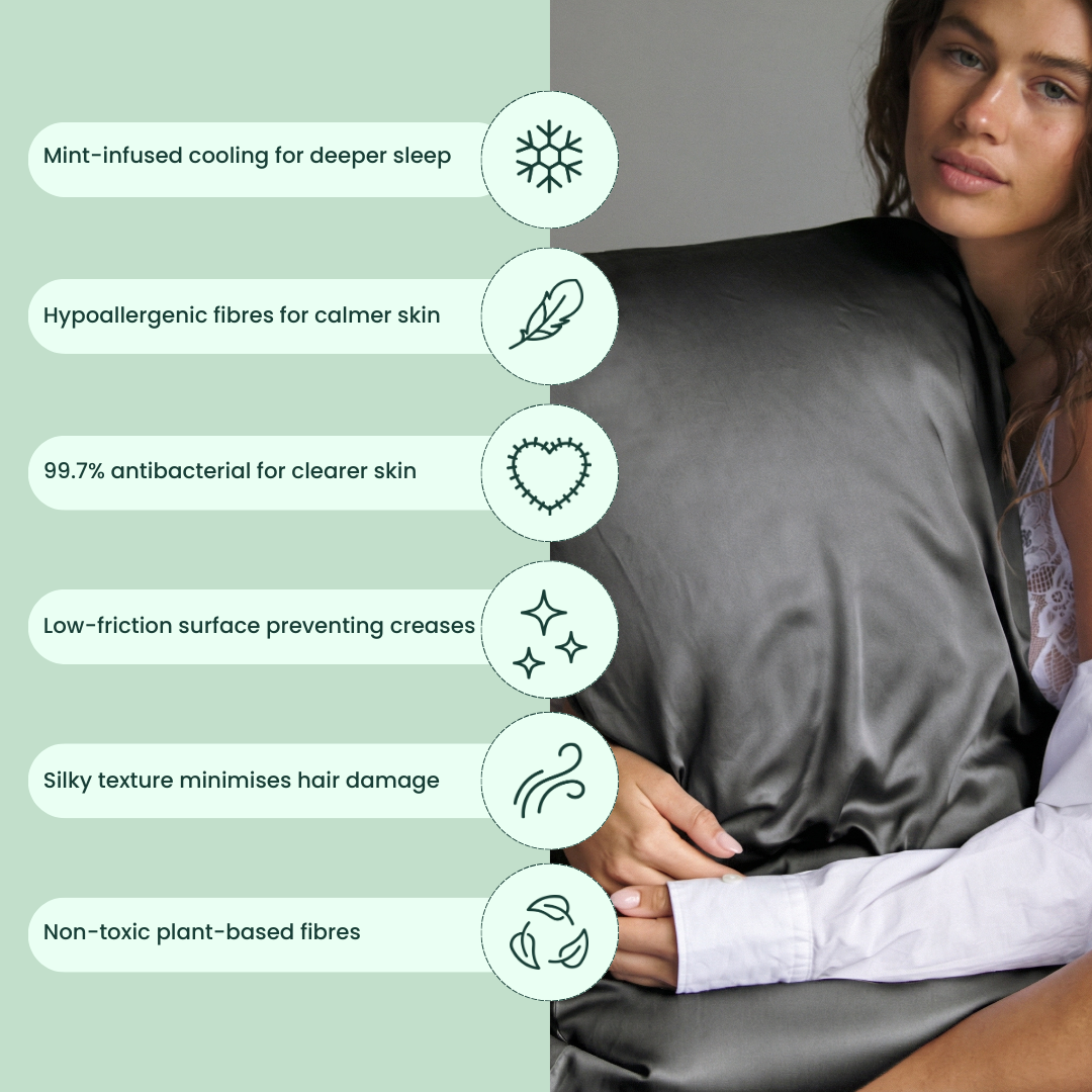 A woman holds a Deep Sleep Bundle dark grey, silky pillowcase, while a list shows its benefits: mint-infused cooling, hypoallergenic, antibacterial, low-friction, reduces hair damage, and plant-based fibres - ideal for deep sleep.