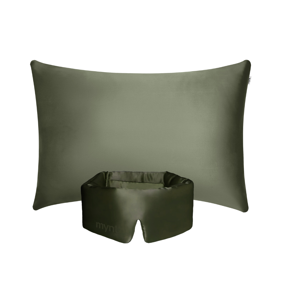 The Deep Sleep Bundle, featuring a rectangular olive green pillow with a cooling pillowcase and a matching sleep mask, is displayed against a white background.