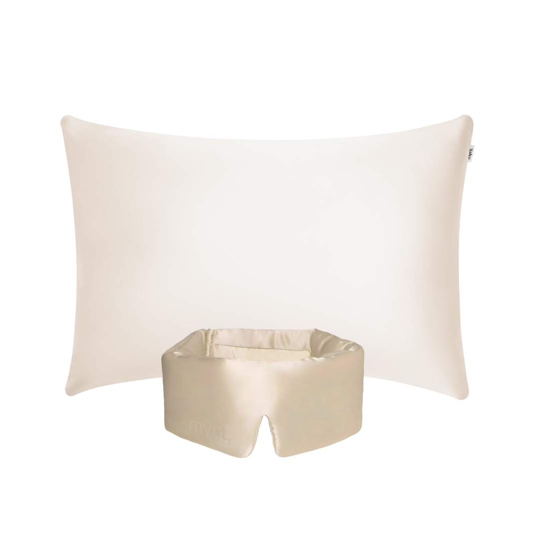 The Deep Sleep Bundle, featuring a sand rectangular pillow with a cooling case and a matching silky contoured blackout sleep mask, is displayed on a white background for optimal rest.