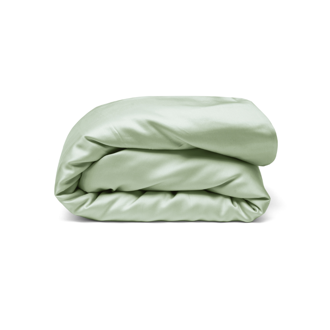 A neatly folded, light green satin Duvet Cover with antibacterial protection displayed against a plain white background.