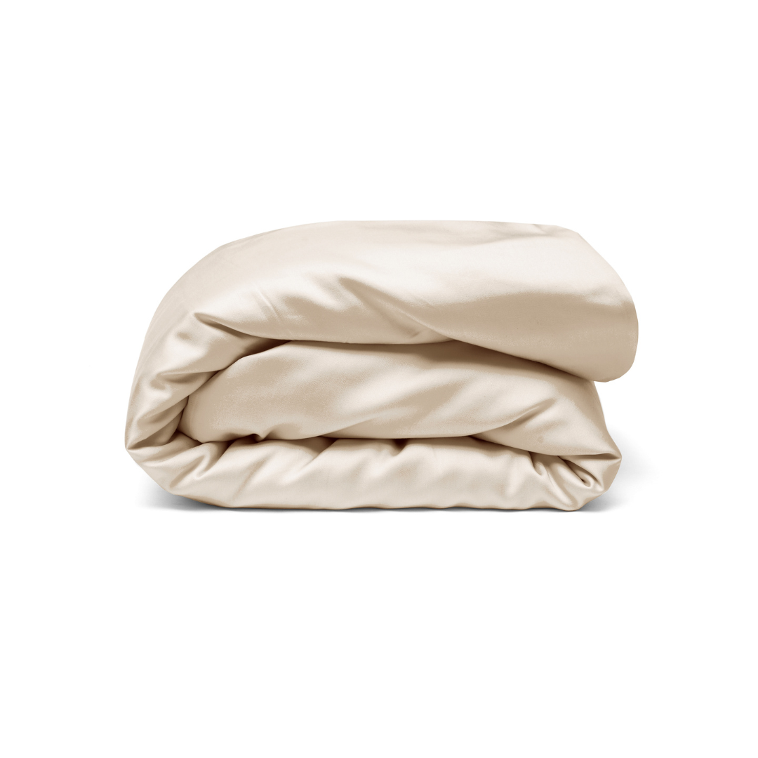 A neatly folded light beige antibacterial satin or silk Duvet Cover is displayed against a plain white background.