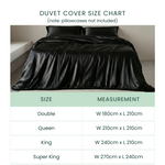 Black duvet cover on a bed with a size chart below.