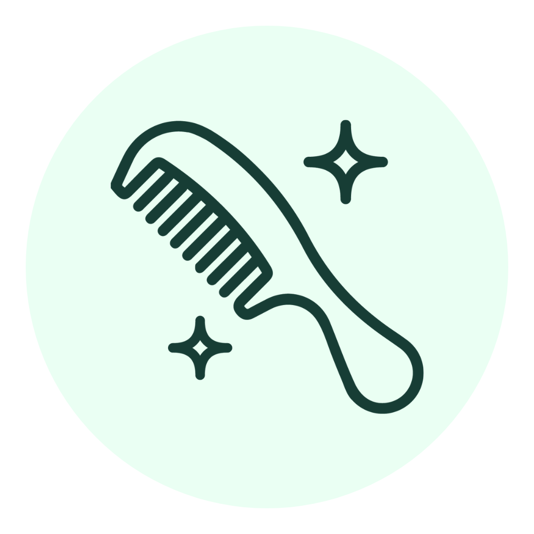A simple line drawing of a comb with sparkles around it, suggesting cleanliness or shine, set against a light green circular background.