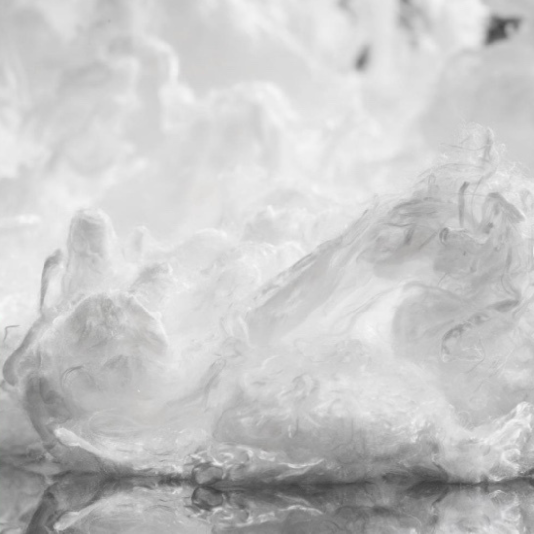 Swirling white clouds or smoke in a soft, dreamy pattern, with wispy textures and reflections on a smooth surface below, creating an ethereal, abstract scene.