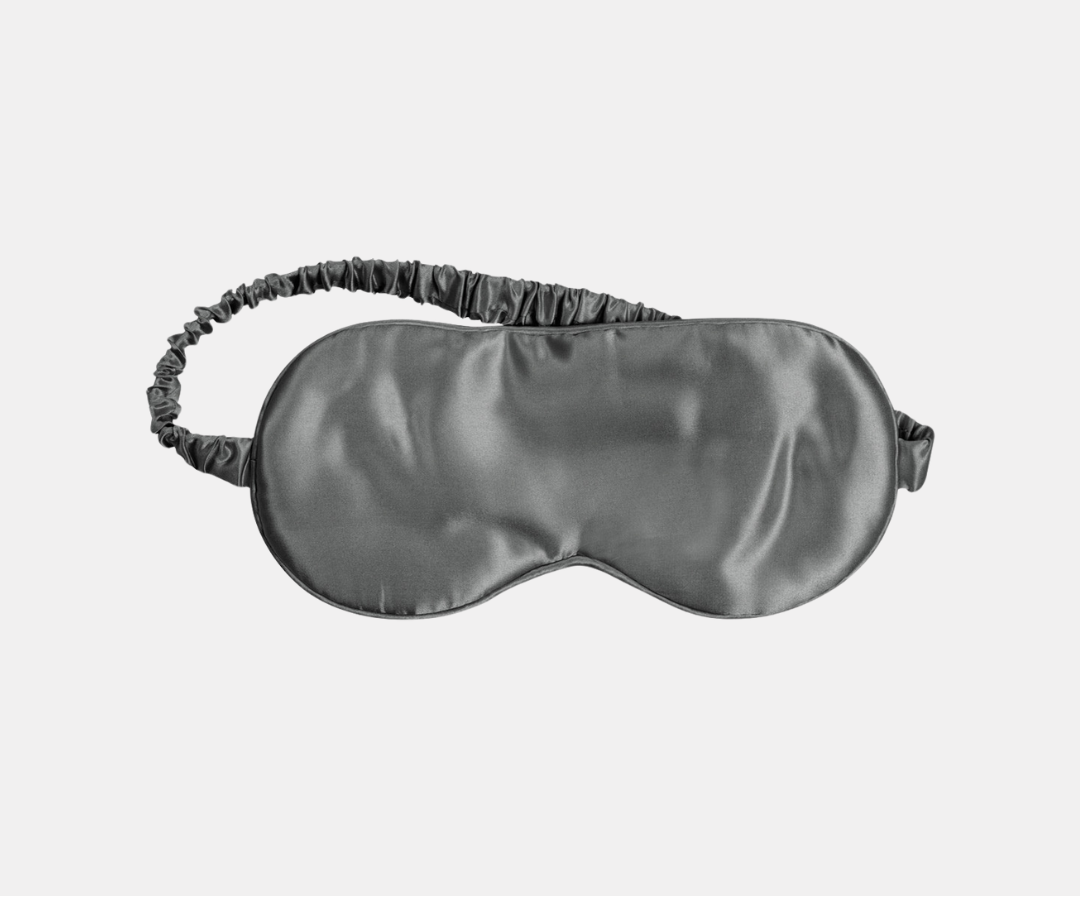 A black satin sleep mask with an elastic strap is centered below the word ALTERNATIVES on a plain light background.