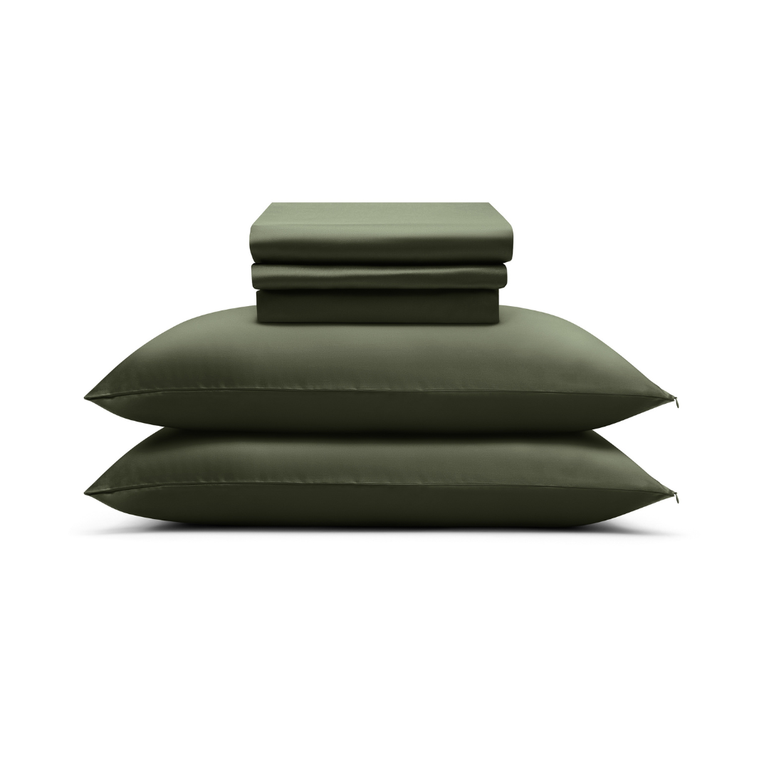 A neatly stacked Complete Sheet Set (4-Piece) in olive green, featuring silky soft sheets, two pillows, and a folded sheet, displayed on a white background.