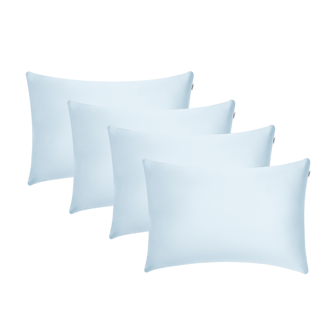 Four light blue rectangular Pillowcases are arranged in two overlapping rows against a white background, offering the perfect setup for beauty sleep and helping you wake up with hydrated skin.