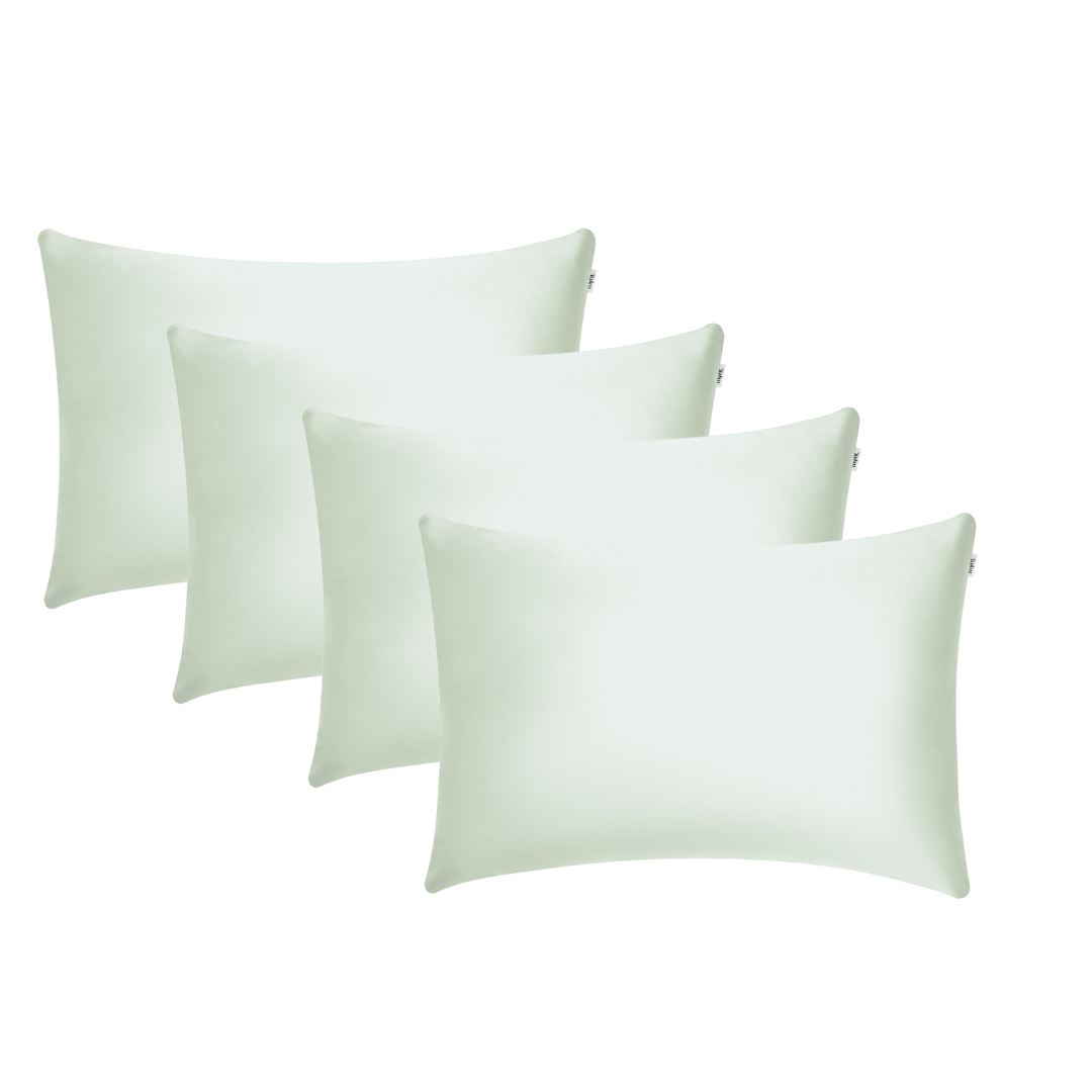 Four sage green rectangular pillowcases are arranged in two rows on a white background, perfect for enhancing beauty sleep and adding a fresh touch to any space.