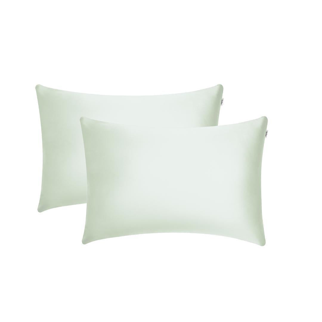Two sage green rectangular pillowcases with a smooth, silky texture are placed side by side on a white background, ideal for beauty sleep and reducing frizz.