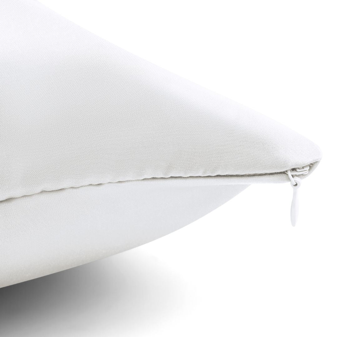 Close-up of a white Pillowcase with a visible zipper along the edge, partially unzipped, against a plain background - ideal for beauty sleep and designed to help reduce frizz overnight.